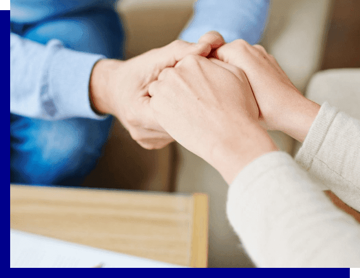 5 Two people holding hands in a room.