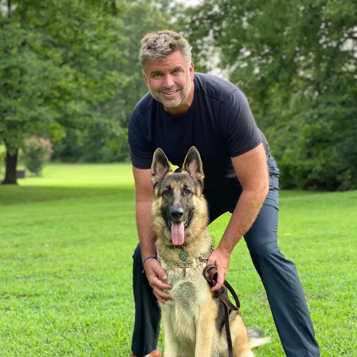 A man and his dog in the park